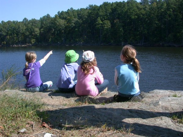 After a hike to Falls Lake from Rockcliff Farm, girls enjoy a rest and a view.
